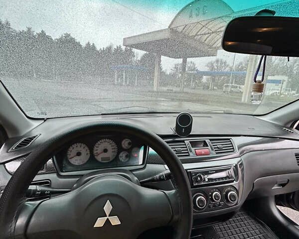 Черный Мицубиси Лансер, объемом двигателя 1.58 л и пробегом 254 тыс. км за 5000 $, фото 22 на Automoto.ua