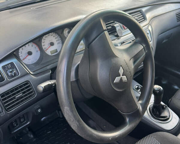 Чорний Міцубісі Lancer, об'ємом двигуна 1.58 л та пробігом 243 тис. км за 3800 $, фото 4 на Automoto.ua