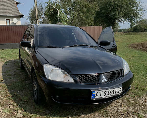 Черный Мицубиси Лансер, объемом двигателя 1.6 л и пробегом 145 тыс. км за 4999 $, фото 6 на Automoto.ua