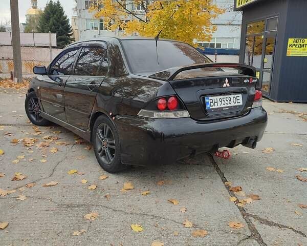 Мицубиси Лансер 2007 в Южноукраинске на Automoto.ua Черный Мицубиси Лансер, объемом двигателя 2 л и пробегом 161 тыс. км за 4600 $, фото 6 на Automoto.ua