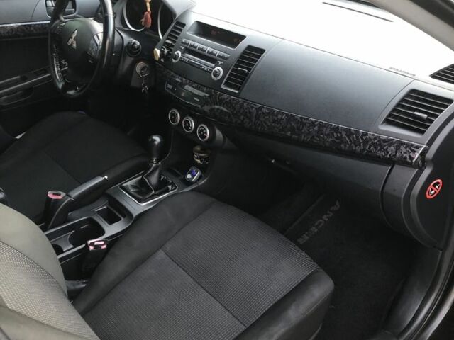 Чорний Міцубісі Lancer, об'ємом двигуна 2 л та пробігом 194 тис. км за 5950 $, фото 5 на Automoto.ua