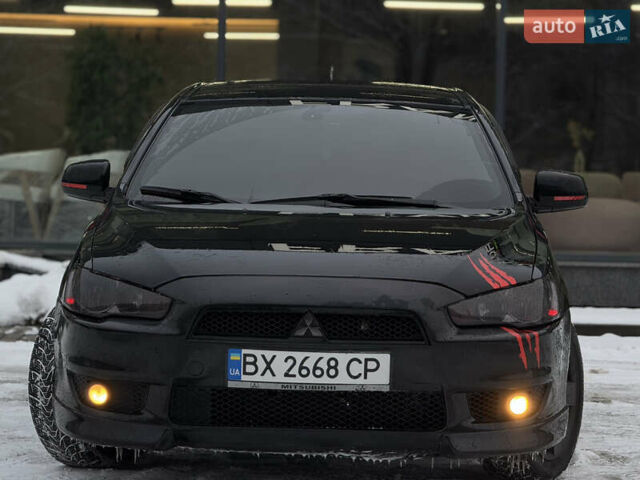Черный Мицубиси Лансер, объемом двигателя 2 л и пробегом 215 тыс. км за 6600 $, фото 32 на Automoto.ua