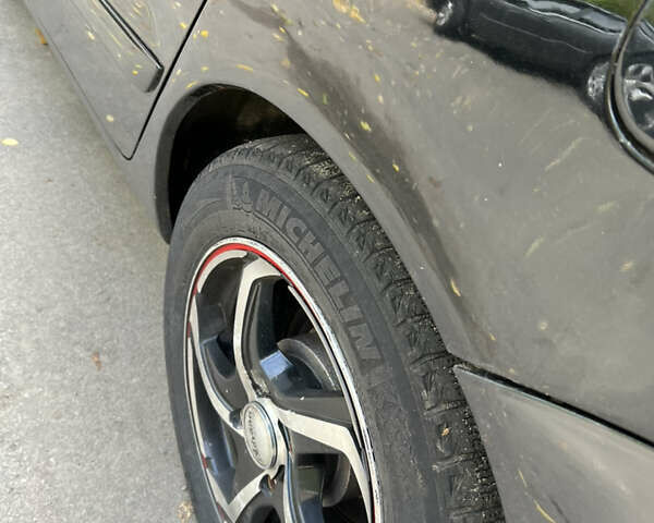 Чорний Міцубісі Lancer, об'ємом двигуна 1.58 л та пробігом 234 тис. км за 3800 $, фото 3 на Automoto.ua