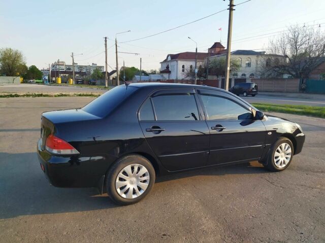 Черный Мицубиси Лансер, объемом двигателя 1.6 л и пробегом 32 тыс. км за 9000 $, фото 12 на Automoto.ua