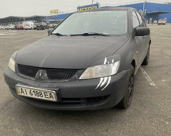 Черный Мицубиси Лансер, объемом двигателя 1.58 л и пробегом 263 тыс. км за 4000 $, фото 4 на Automoto.ua