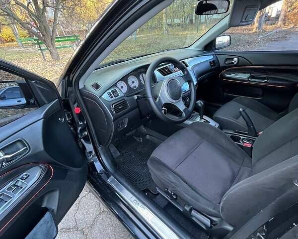 Черный Мицубиси Лансер, объемом двигателя 2 л и пробегом 280 тыс. км за 5400 $, фото 11 на Automoto.ua