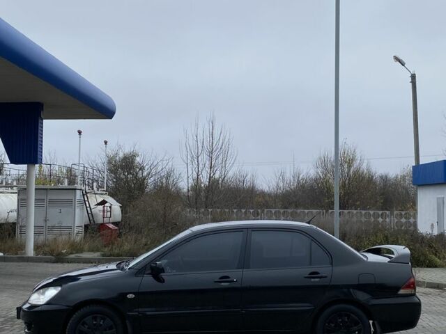 Черный Мицубиси Лансер, объемом двигателя 1.6 л и пробегом 263 тыс. км за 2900 $, фото 6 на Automoto.ua