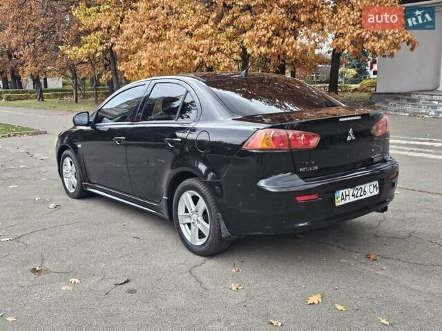 Міцубісі Lancer 2007 у Києві на Automoto.ua Чорний Міцубісі Lancer, об'ємом двигуна 2 л та пробігом 115 тис. км за 5000 $, фото 7 на Automoto.ua