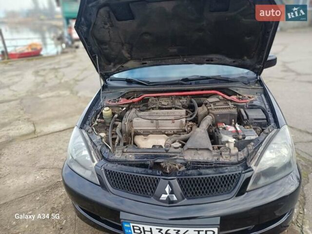 Черный Мицубиси Лансер, объемом двигателя 2 л и пробегом 286 тыс. км за 4000 $, фото 15 на Automoto.ua