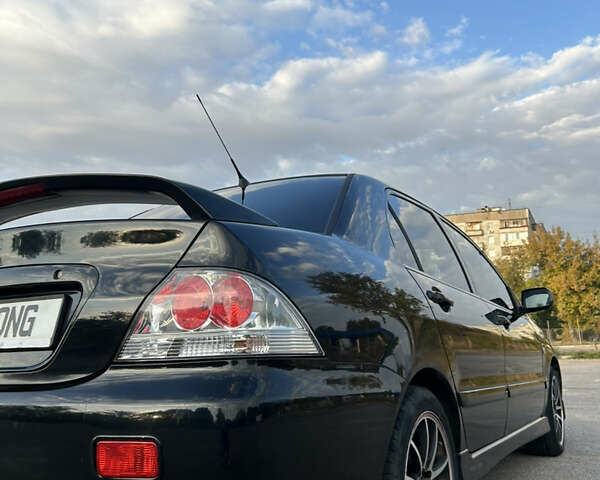 Чорний Міцубісі Lancer, об'ємом двигуна 2 л та пробігом 280 тис. км за 4600 $, фото 23 на Automoto.ua