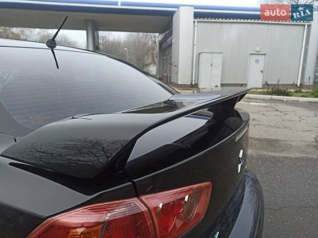 Черный Мицубиси Лансер, объемом двигателя 2 л и пробегом 195 тыс. км за 7899 $, фото 27 на Automoto.ua