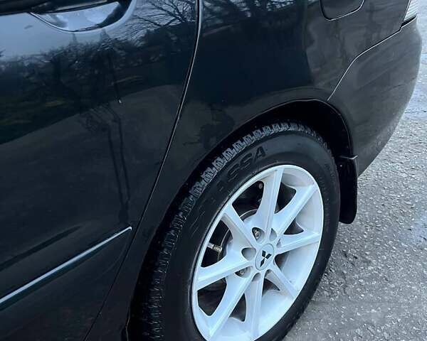 Черный Мицубиси Лансер, объемом двигателя 1.6 л и пробегом 249 тыс. км за 5000 $, фото 21 на Automoto.ua