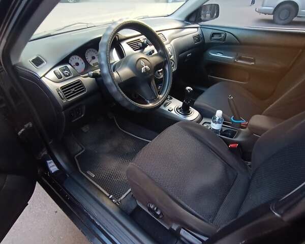 Чорний Міцубісі Lancer, об'ємом двигуна 1.6 л та пробігом 296 тис. км за 4500 $, фото 2 на Automoto.ua