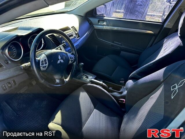 Черный Мицубиси Лансер, объемом двигателя 2 л и пробегом 250 тыс. км за 5900 $, фото 1 на Automoto.ua