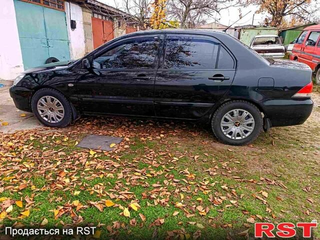 Чорний Міцубісі Lancer, об'ємом двигуна 1.6 л та пробігом 227 тис. км за 4100 $, фото 3 на Automoto.ua
