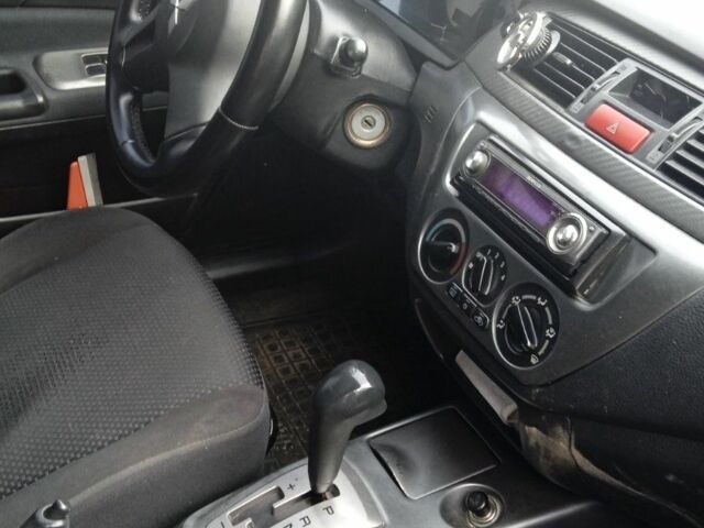 Черный Мицубиси Лансер, объемом двигателя 1.6 л и пробегом 223 тыс. км за 4300 $, фото 5 на Automoto.ua