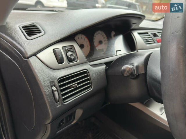 Чорний Міцубісі Lancer, об'ємом двигуна 1.58 л та пробігом 173 тис. км за 4700 $, фото 12 на Automoto.ua