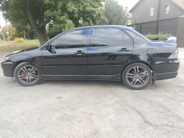 Міцубісі Lancer 2007 у Кам'янське (Дніпродзержинськ) на Automoto.ua Чорний Міцубісі Lancer, об'ємом двигуна 2 л та пробігом 268 тис. км за 5999 $, фото 2 на Automoto.ua