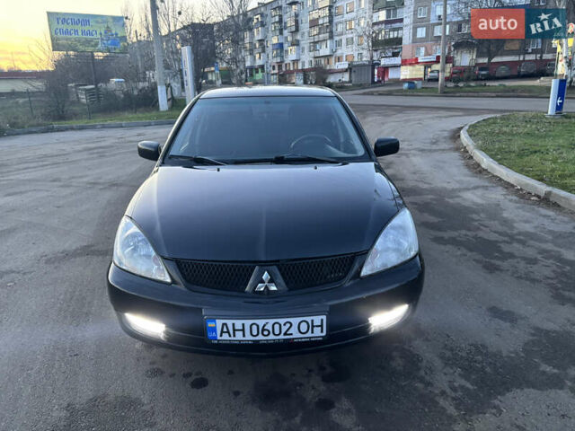 Черный Мицубиси Лансер, объемом двигателя 1.6 л и пробегом 315 тыс. км за 4000 $, фото 4 на Automoto.ua