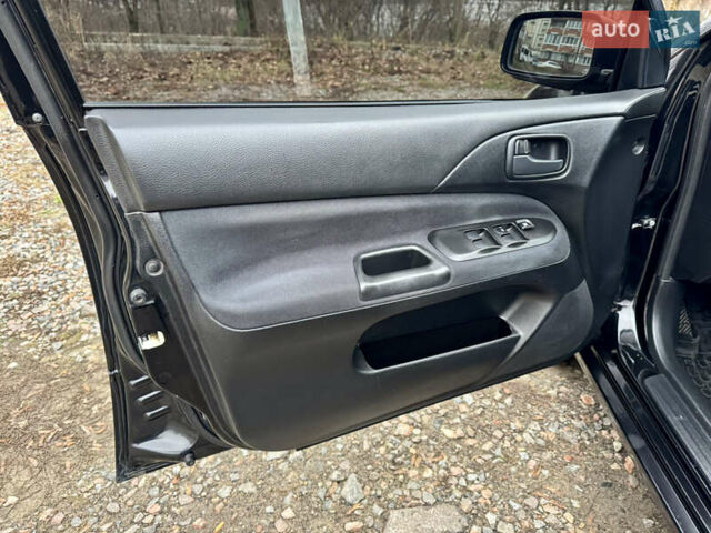 Черный Мицубиси Лансер, объемом двигателя 1.6 л и пробегом 216 тыс. км за 4990 $, фото 12 на Automoto.ua