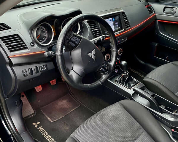 Черный Мицубиси Лансер, объемом двигателя 2 л и пробегом 164 тыс. км за 8300 $, фото 16 на Automoto.ua