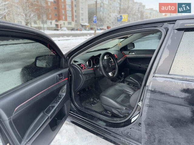 Черный Мицубиси Лансер, объемом двигателя 2 л и пробегом 215 тыс. км за 6600 $, фото 19 на Automoto.ua