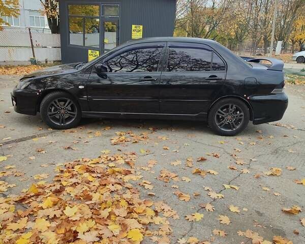 Мицубиси Лансер 2007 в Южноукраинске на Automoto.ua Черный Мицубиси Лансер, объемом двигателя 2 л и пробегом 161 тыс. км за 4600 $, фото 7 на Automoto.ua