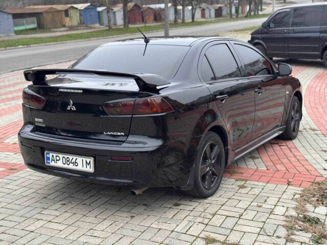 Черный Мицубиси Лансер, объемом двигателя 2 л и пробегом 217 тыс. км за 5500 $, фото 7 на Automoto.ua
