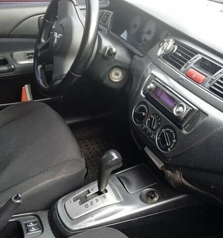 Черный Мицубиси Лансер, объемом двигателя 1.6 л и пробегом 223 тыс. км за 4300 $, фото 4 на Automoto.ua