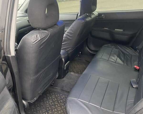 Черный Мицубиси Лансер, объемом двигателя 1.58 л и пробегом 263 тыс. км за 4000 $, фото 28 на Automoto.ua