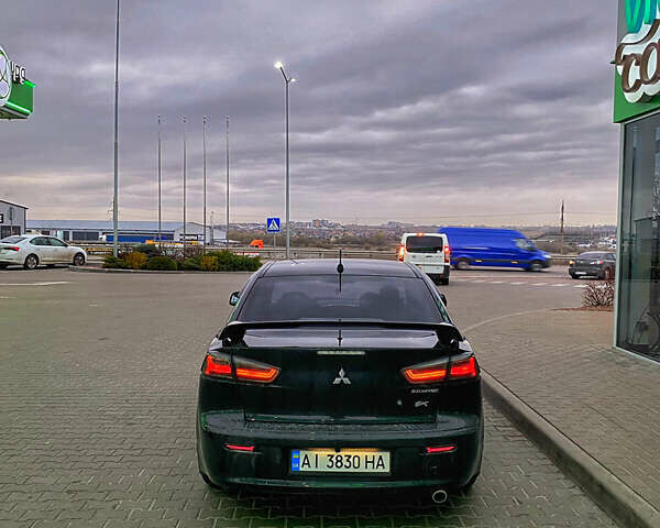 Черный Мицубиси Лансер, объемом двигателя 2 л и пробегом 164 тыс. км за 8300 $, фото 14 на Automoto.ua