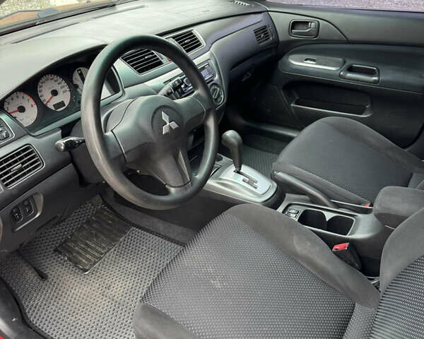 Чорний Міцубісі Lancer, об'ємом двигуна 1.6 л та пробігом 195 тис. км за 5000 $, фото 12 на Automoto.ua