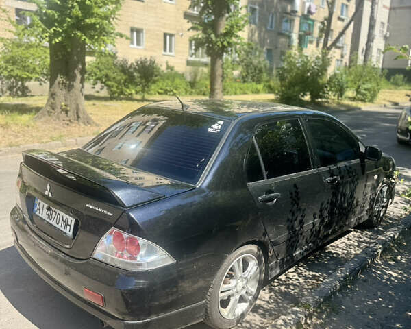 Чорний Міцубісі Lancer, об'ємом двигуна 2 л та пробігом 210 тис. км за 5500 $, фото 46 на Automoto.ua