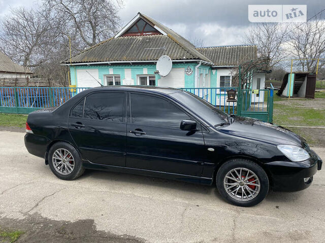 Чорний Міцубісі Lancer, об'ємом двигуна 1.6 л та пробігом 235 тис. км за 4900 $, фото 3 на Automoto.ua