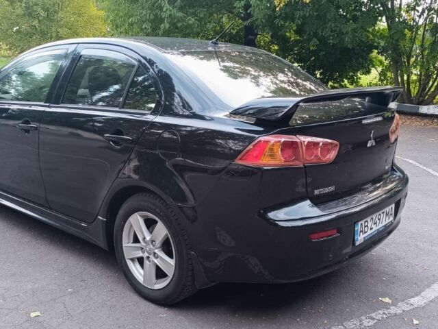 Черный Мицубиси Лансер, объемом двигателя 2 л и пробегом 210 тыс. км за 6000 $, фото 6 на Automoto.ua