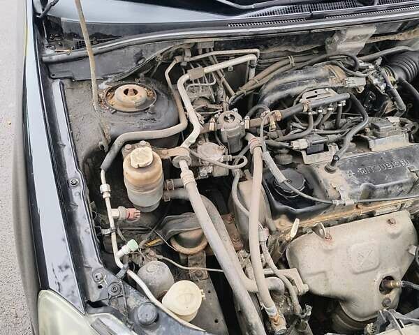 Черный Мицубиси Лансер, объемом двигателя 1.6 л и пробегом 309 тыс. км за 4000 $, фото 24 на Automoto.ua