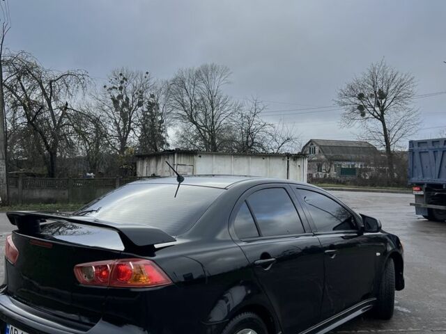 Черный Мицубиси Лансер, объемом двигателя 2 л и пробегом 350 тыс. км за 6700 $, фото 1 на Automoto.ua