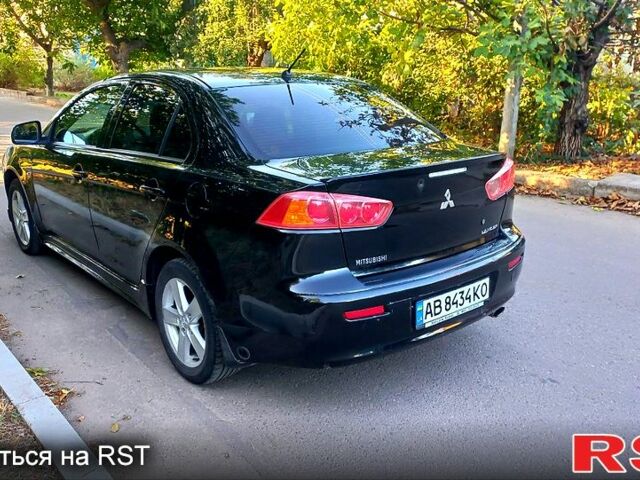 Черный Мицубиси Лансер, объемом двигателя 2 л и пробегом 290 тыс. км за 5800 $, фото 2 на Automoto.ua