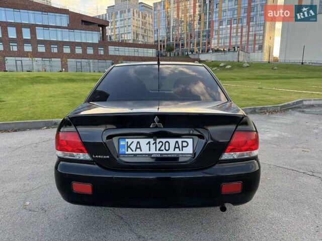 Черный Мицубиси Лансер, объемом двигателя 1.58 л и пробегом 237 тыс. км за 3999 $, фото 9 на Automoto.ua