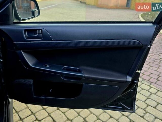 Чорний Міцубісі Lancer, об'ємом двигуна 2 л та пробігом 260 тис. км за 6555 $, фото 33 на Automoto.ua