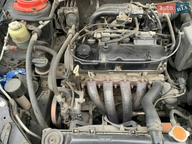 Черный Мицубиси Лансер, объемом двигателя 1.6 л и пробегом 164 тыс. км за 5200 $, фото 16 на Automoto.ua