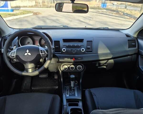 Черный Мицубиси Лансер, объемом двигателя 2 л и пробегом 224 тыс. км за 7000 $, фото 6 на Automoto.ua