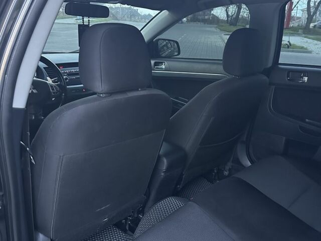 Черный Мицубиси Лансер, объемом двигателя 2 л и пробегом 242 тыс. км за 6200 $, фото 15 на Automoto.ua