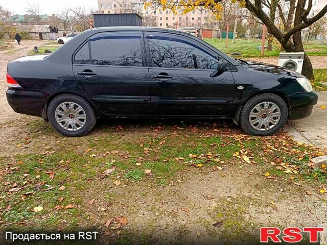 Чорний Міцубісі Lancer, об'ємом двигуна 1.6 л та пробігом 227 тис. км за 4100 $, фото 7 на Automoto.ua