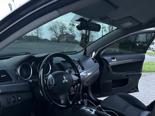 Черный Мицубиси Лансер, объемом двигателя 2 л и пробегом 242 тыс. км за 6200 $, фото 13 на Automoto.ua