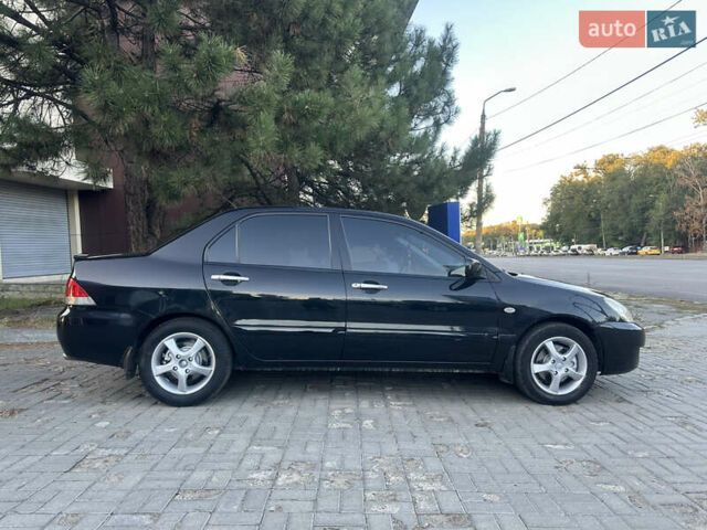 Черный Мицубиси Лансер, объемом двигателя 1.59 л и пробегом 269 тыс. км за 4999 $, фото 3 на Automoto.ua