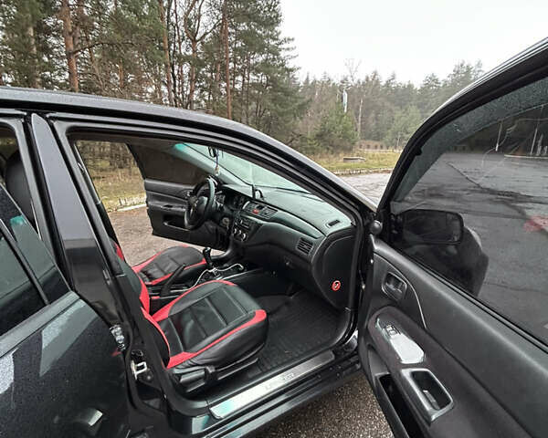 Черный Мицубиси Лансер, объемом двигателя 1.58 л и пробегом 254 тыс. км за 5000 $, фото 19 на Automoto.ua