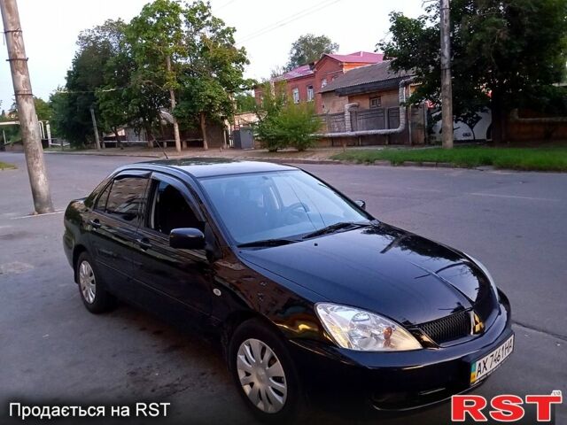 Черный Мицубиси Лансер, объемом двигателя 1.6 л и пробегом 247 тыс. км за 4000 $, фото 6 на Automoto.ua