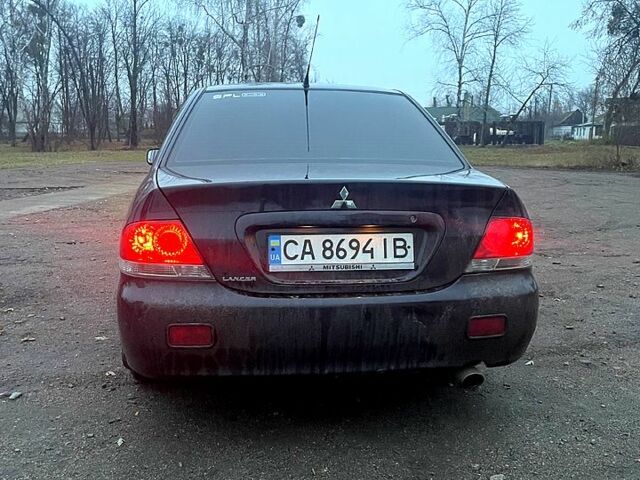 Чорний Міцубісі Lancer, об'ємом двигуна 1.6 л та пробігом 201 тис. км за 4000 $, фото 5 на Automoto.ua