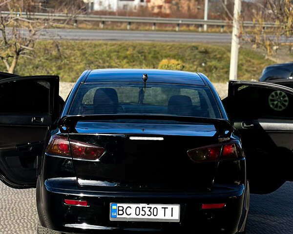 Черный Мицубиси Лансер, объемом двигателя 2 л и пробегом 333 тыс. км за 7300 $, фото 7 на Automoto.ua